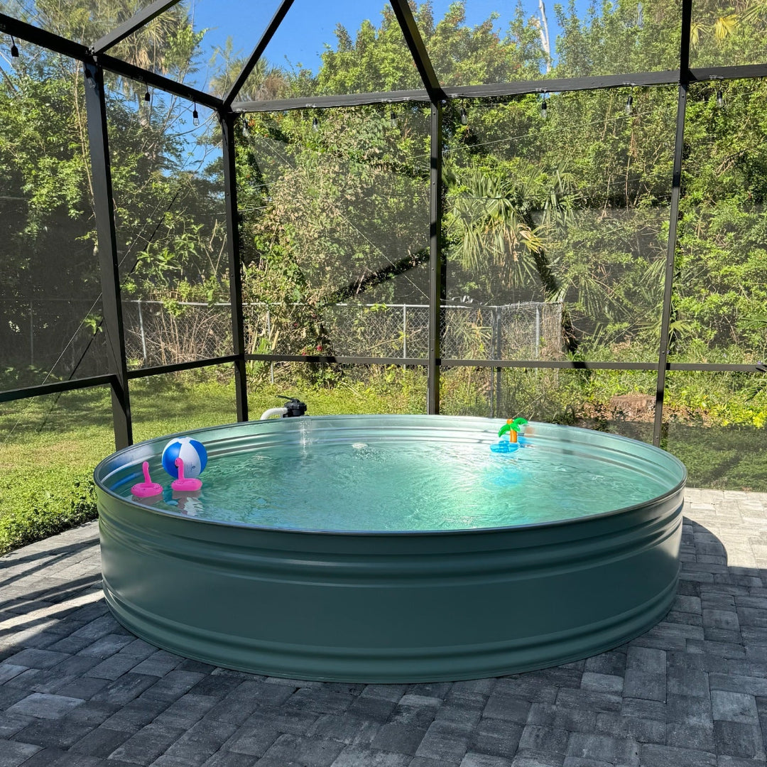 Green above-ground pool with children's toys in a backyard setting