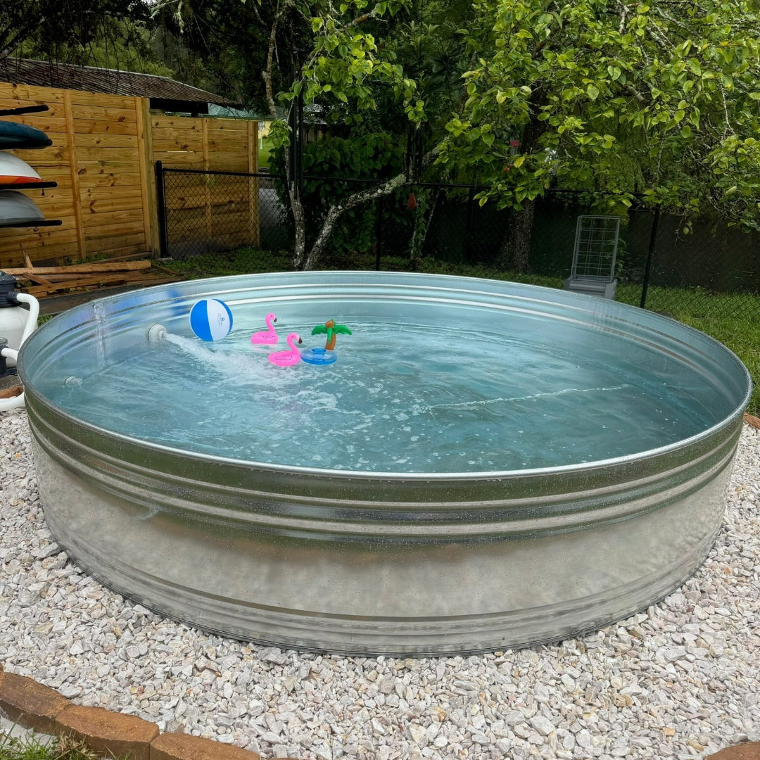 Metallic above-ground pool with children's toys in a backyard setting