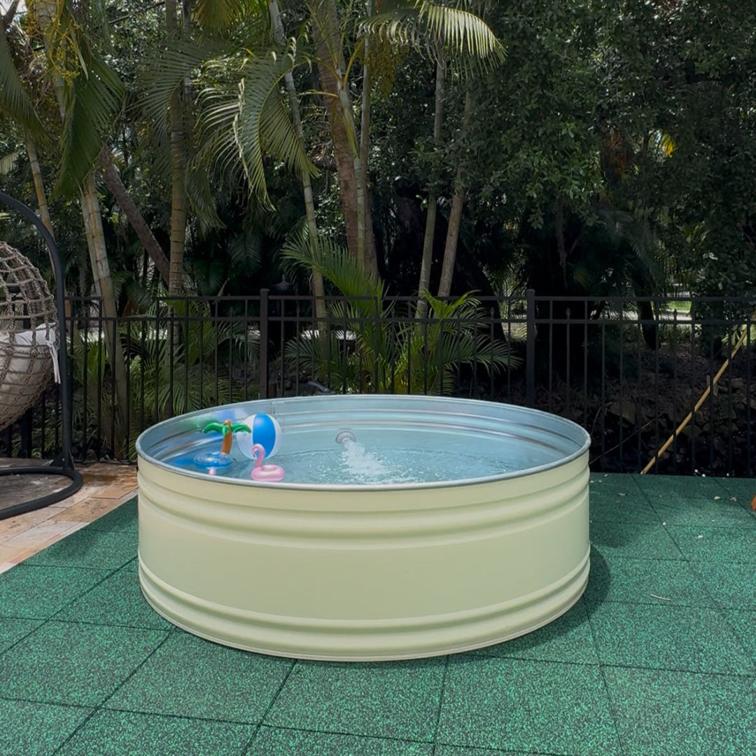 Round above-ground pool with toys on a green patio