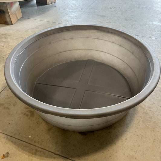 Gray plastic basin on a concrete floor